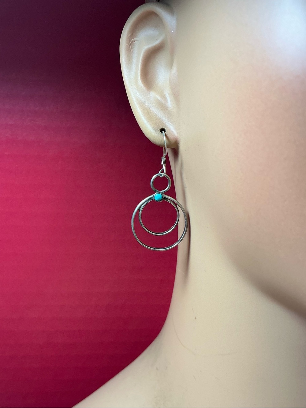 Sterling Silver Navajo Style Double Hoop Earrings with a Turquoise Stone.